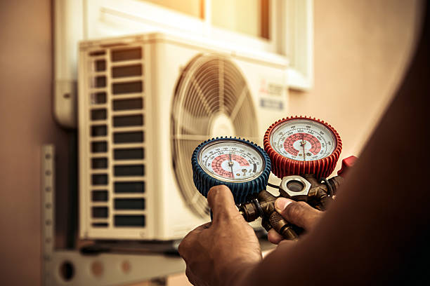 Professional Ductwork Repair technician working in Plainville, MA